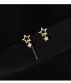 Close-up of asymmetric gold star earrings with hollow design and crystal tassels - Asymmetric Star Studs / Gold