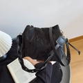 Glossy black pleated bucket bag with metallic gold accents and slim shoulder strap - Black