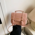 Pink PU leather crossbody bag with dual buckles and golden fashion hardware - Pink