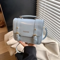 Light blue minimalist handbag with gold FASHION text and metal buckle accents - Blue