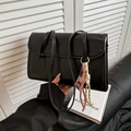 Chic black faux leather underarm bag with contrast stitching and colorful pendant - Black Single Bag