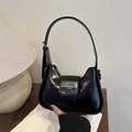Glossy black French baguette shoulder bag with silver hardware and embossed logo - Black