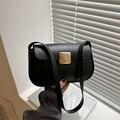 Minimalist black shoulder bag with a square gold metal clasp and smooth leather finish - Black