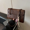 Dark brown retro underarm bag in polished wax leather with stylish cartoon pendant - Coffee Single Bag