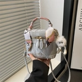 Light gray bucket bag with silk scarf handle and plush charm, fashion crossbody style - With Pendant / Silver