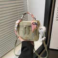 Light green marbled bucket bag with floral scarf handle and plush ball charm detail - With Pendant / Green