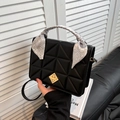 Black quilted crossbody bag with golden rotary lock and decorative paisley handle scarf - Black