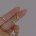 Detail of gold grape earrings with sparkling white crystals and vintage French design - Mini Grape Style