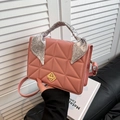 Pink quilted crossbody bag with silk scarf handle and golden metal turn-lock closure - Pink