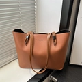 Minimalist brown PU leather tote bag with FASHION text and dual handles on a white surface - Brown