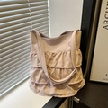 Dusty pink tote bag featuring multi-layered ruffle trim and adjustable shoulder strap - Pink