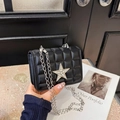 Elegant black quilted chain bag featuring a rhinestone star and silver metal strap - Black