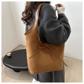 Detail of warm brown suede tote bag with a minimalist bow and smooth matte texture - Brown