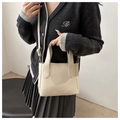 Detail of cream white lychee leather mini tote bag with adjustable strap and gold hardware - Off White