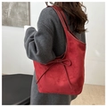 Dark red matte shoulder bag with bow detail shown on shoulder for professional look - Red