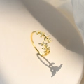 Elegant gold leaf ring with sparkling cubic zirconia stones and adjustable open band design - Gold