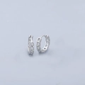Close-up of silver flat chain huggie earrings with a high-polished metallic finish - Geometric Chain Earrings - Platinum Narrow