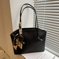 Chic black leather tote bag with silk scarf accent and white contrast stitching detail - Black