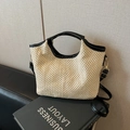 Borsa a secchiello in paglia beige con finiture in pelle PU nera e tracolla - Nero e Bianco