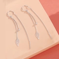 Close-up of S925 silver long tassel earrings with leaf charms and delicate beads - Silver (Leaf Tassel Ear Line)