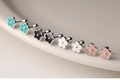 Macro view of colorful enamel flower earrings with secure screw back ball closures - Drip Glue Flower Screw Stud Earrings - Black