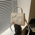 Structured white faux leather handbag with embossed star and gold hardware - White
