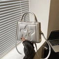 Silver mini crossbody bag featuring a 3D star relief design and metallic finish - Silver