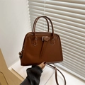 Classic brown faux leather tote bag with sturdy handles and adjustable shoulder strap - Tan