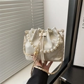 White bucket bag with golden floral embroidery and large pearl handle for elegant style - White Floral