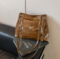 Brown vintage tote bag with distressed leather texture and golden chain strap - Brown