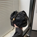 Fashionable black drawstring bucket bag with pleated texture and golden chain strap - Black