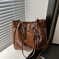 Brown vintage faux leather shoulder bag with a metal bow and badminton racket charm - Single Bag / Brown