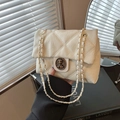 Chic cream quilted chain bag featuring a crown bear buckle and elegant pleated leather - White