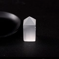 Polished selenite crystal energy wand with silky fiber texture on dark background - Small Selenite Single Point Column