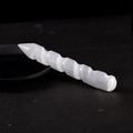 Handcrafted white selenite spiral massage wand with natural fiber texture on black surface - Spiral Massage Wand Single Point