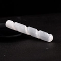 Polished white selenite crystal spiral massage wand on a matte black background - Spiral Massage Wand