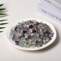 Polished natural colorful fluorite stone chips in a white ceramic tray for decoration - 7-9mm 100g