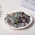 Polished natural colorful fluorite tumbled stones in a white decorative bowl - 9-12mm 100g