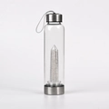 Portable glass water bottle with internal natural crystal pillar and stainless steel caps - White Crystal