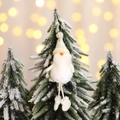 White plush Santa elf ornament with long beard and golden string on snowy Christmas tree - Santa Claus