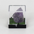 Natural raw amethyst specimen in a clear acrylic display box with green faux moss base - Amethyst