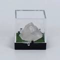 Natural white crystal specimen in a clear display box with green faux grass base - White Crystal