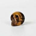 Hand-carved tiger eye gemstone skull ornament with natural brown and gold stripes - 1.5 Inch / Tiger's Eye