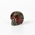 Red jasper skull figurine with natural speckled texture and detailed hand carving - 1.5 Inch / Dragon Blood Stone