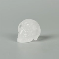 Carved clear quartz skull ornament with detailed translucent gemstone craftsmanship - 1.5 Inch / White Crystal
