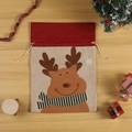 Christmas burlap gift bag with reindeer pattern and drawstring on wooden background - L / Elk