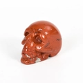 Hand-carved red jasper skull ornament with natural stone texture and polished finish - 2 Inch / Red Jasper
