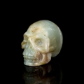 Blue and yellow natural gemstone skull figurine with crystal texture on black background - 2 Inch / Sky Blue