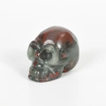Hand-carved bloodstone skull figurine with polished finish and natural mottled pattern - 2 Inch / African Blood Stone