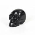 Polished black gemstone skull carving ornament with smooth reflective surface - 2 Inch / Obsidian